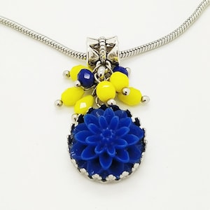 Blue and yellow flower charm drop necklace made of acrylic cabochon, crystals with SW elements, stainless steel chain, other metal details