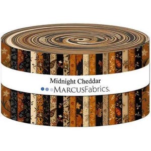 May include: A jelly roll of fabric strips featuring a variety of floral and paisley patterns in shades of black, brown, orange, and cream. A white paper band wraps around the center with the text Midnight Cheddar and MARCUSFABRICS.