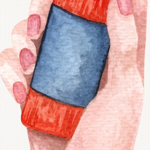 May include: A hand holding a red and blue spray bottle. The bottle has a label with a blue background.