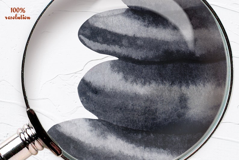 May include: A close-up of three gray and black watercolor painted stones stacked on top of each other. The stones are painted with a gradient of gray and black, and the edges are slightly blurred.
