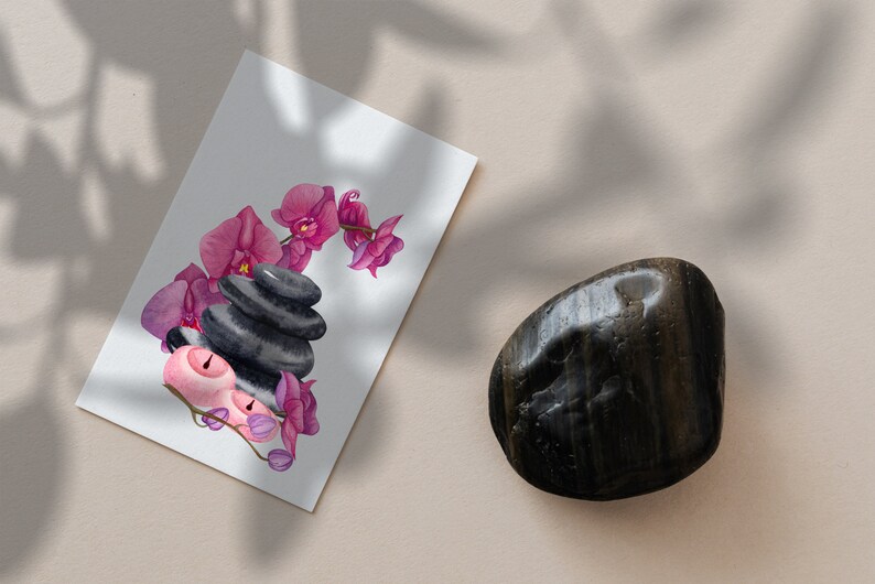 May include: A watercolor illustration of pink orchids and black stones arranged in a stack, with two pink candles on the bottom. The illustration is on a white card.