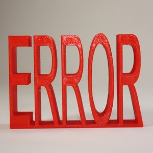 May include: A red plastic word sculpture that spells out "ERROR".