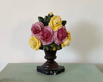Oxford Cast iron door stopper in the shape of a flower pot with pink and yellow flowers