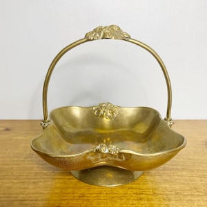 Solid brass trinket dish with handle, pedestal basket with flowers details