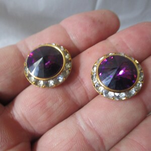 Pretty Costume High Fashion Large Stud Pierced with Amethyst Center Stone Surrounded by White Rhinestones