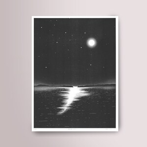 May include: Monochrome print of a moonlit seascape. The artwork shows a bright full moon and stars in the night sky, reflected on the water's surface. The print has a minimalist style, with the artist's signature at the bottom.