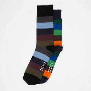May include: Two pairs of striped socks in a variety of colors, including green, blue, orange, brown, and gray. The socks have the word "p.p.o" written on them.
