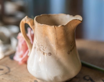 Precious cream pitcher, Victorian antique with lots of stains, crazing