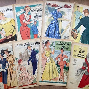 May include: A collection of eight vintage Le Petit Echo de la Mode magazines featuring illustrated covers of various fashion styles, including dresses, coats, and suits in colors like red, blue, yellow, and green, with aged paper textures.