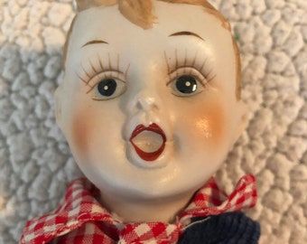 creepy male doll