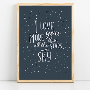 May include: A navy blue framed print with white text that reads "I love you more than all the stars in the sky" with white stars scattered across the background.