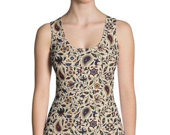 May include: A sleeveless tank top with a cream background and a colourful floral pattern. The pattern features paisley shapes, flowers, and leaves in shades of blue, green, red, and yellow.