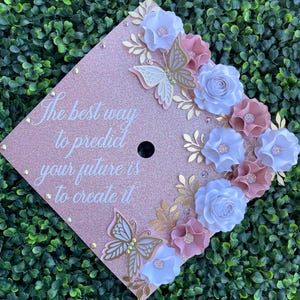 Graduation cap topper with paper flowers and butterflies grad cap