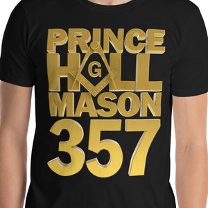 May include: Black t-shirt with gold text that reads "Prince Hall Mason 357" with a gold Masonic symbol.
