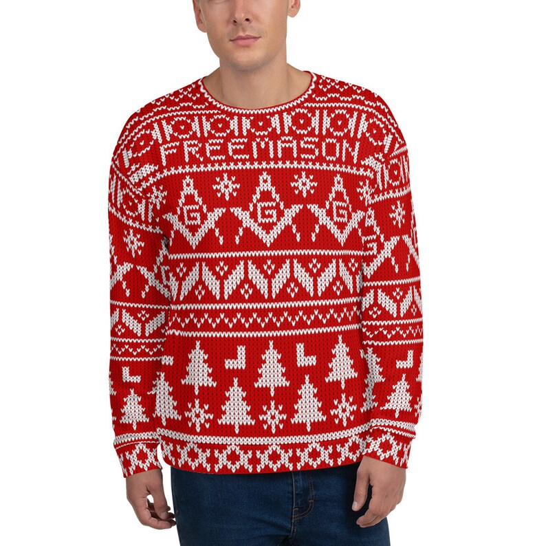 May include: Red and white Christmas sweater with a Fair Isle pattern featuring a repeating design of snowflakes, Christmas trees, and the word "FREEMASON".