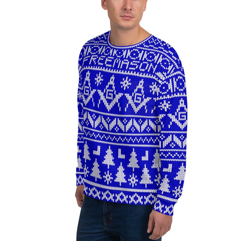 May include: Blue and white Christmas sweater with a geometric pattern and the word "FREEMASON" in white letters.