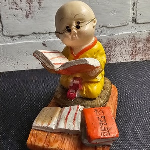 Shaolin monk boy with Chinese script - resin figure - collectable