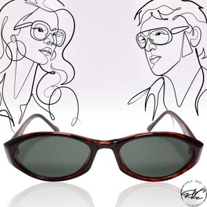 May include: A pair of brown tortoise shell oval-shaped sunglasses with dark gray lenses. The sunglasses are sitting on a white surface with a reflection of the sunglasses below them. The image also includes a line drawing of a woman and a man wearing sunglasses.