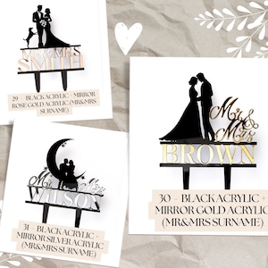 Peut inclure: Des d&eacute;corations de g&acirc;teau de mariage en acrylique noir avec des accents miroir or, argent ou or rose. Les mod&egrave;les incluent un couple, un couple avec un chien et un couple sur un croissant de lune. Chaque d&eacute;coration porte le texte "Mr & Mrs" et un nom de famille.