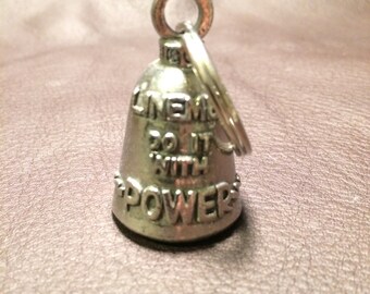 May include: Silver motorcycle bell with a ring and the inscription "Live life to the fullest, do it with power".