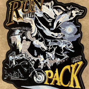 May include: Black and yellow embroidered patch with the text "Run with the Pack" and a silhouette of a motorcycle rider and wolves.