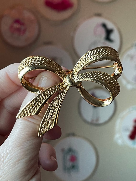 Vintage Bow Brooch, Gold Tone Costume Jewelry - image 1