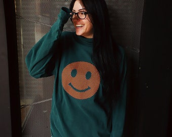 orange black checkered checkerboard smiley face applique long sleeve turtleneck shirt sweater forest green