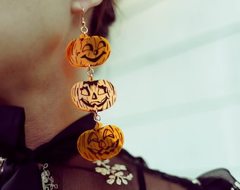 Handcrafted translucent orange Halloween Jack-o-Lantern dangle earrings - Beistle inspired