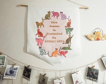 This house is protected by street cats pennant banner - tnr / trap neuter return / cat lady