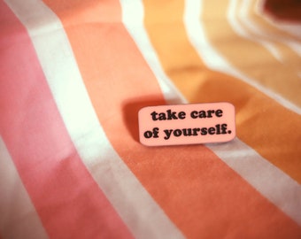 Handcrafted laser cut pastel pink acrylic "take care of yourself" pin