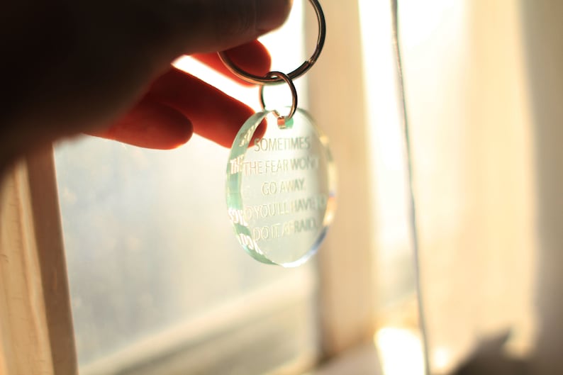 sometimes the fear won/'t go away so you/'ll have to do it afraid quote Handcrafted laser cut clear glass green acrylic keychain