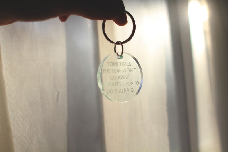 sometimes the fear won/'t go away so you/'ll have to do it afraid quote Handcrafted laser cut clear glass green acrylic keychain