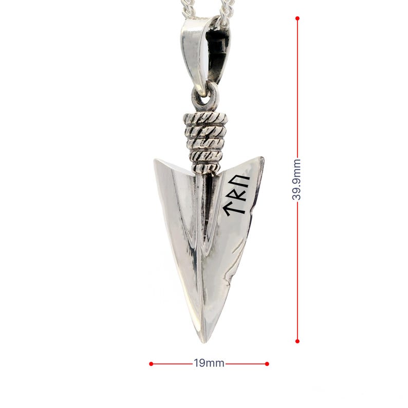 May include: A silver arrowhead pendant featuring a textured rope-style bail and engraved runic characters on the blade. The pendant measures 39.9mm in height and 19mm in width, as indicated by the red measurement lines visible in the image.