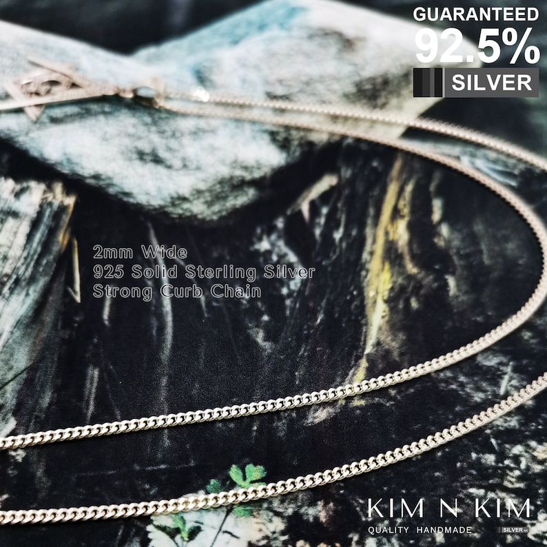 May include: A silver curb chain necklace, 2mm wide, made of 925 solid sterling silver. The chain is shown on a camouflage background. The text "GUARANTEED 92.5% SILVER" is visible in the top right corner of the image. The text "KIM N KIM QUALITY HANDMADE SILVER" is visible in the bottom right corner of the image.