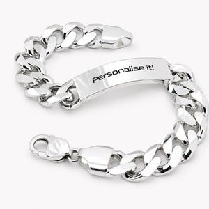 May include: A polished silver-tone curb chain bracelet featuring a central rectangular identification plate. The plate is engraved with the black text "Personalise it!". The bracelet is secured with a lobster claw clasp and has a high-shine finish.