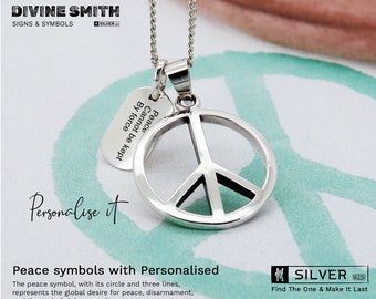 May include: A silver peace sign pendant necklace with a small tag that reads "Peace Cannot be kept By force". The necklace is on a white surface with a green pattern.