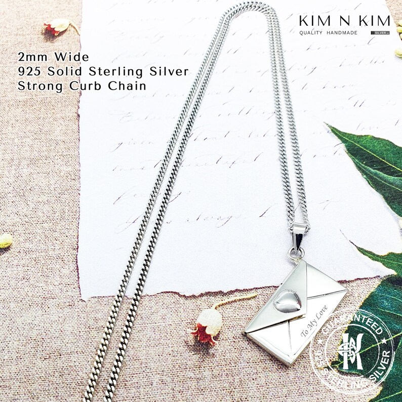 May include: A silver necklace with a 2mm wide curb chain and a silver pendant shaped like an envelope with a heart on the front. The pendant has the text "To My Love" engraved on it. The necklace is handmade and comes with a guarantee of quality.