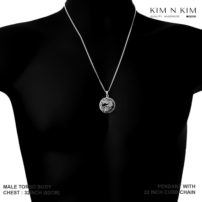 May include: Silver pendant necklace with a detailed design of two intertwined fish. The necklace is 22 inches long and has a curb chain style.
