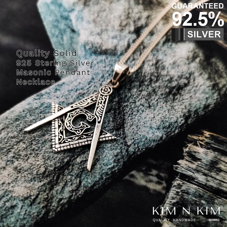 May include: A silver Masonic pendant necklace with a square and compass design. The pendant is made of 92.5% sterling silver and is guaranteed to be of high quality.