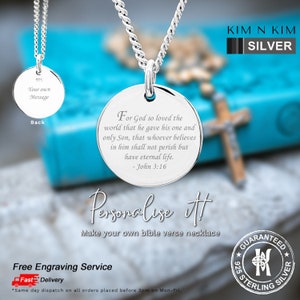 May include: A silver pendant necklace with a circular pendant. The pendant is engraved with the Bible verse John 3:16. The reverse side of the pendant is also visible, with space for a message. The necklace is made of 925 sterling silver.