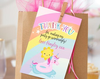 May include: A pink and yellow thank you card with a rainbow, stars, and a unicorn riding a pink inflatable ring. The text on the card reads "Thank You for making my party go swimmingly! Love Hayley xxx".