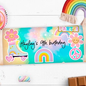 May include: A colorful party favor wrapper with a rainbow, a roller skate, and a peace sign. The wrapper says "Hayley's 9th birthday" and "Party!" in gold letters.