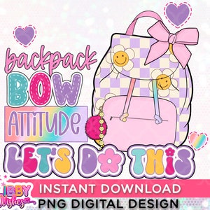 May include: A pink and purple checkered backpack with a pink bow and a rainbow charm. The text "backpack bow attitude let's do this" is written in colorful letters.
