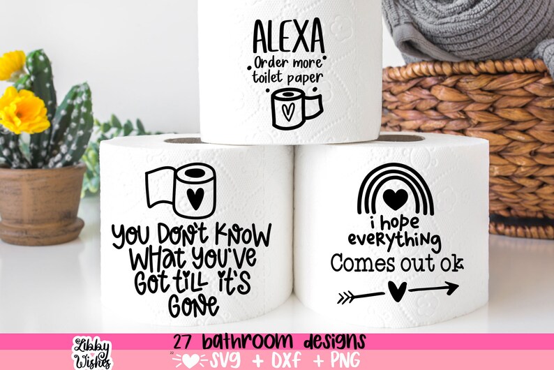 May include: Three white toilet paper rolls with black text and illustrations. The top roll says "Alexa Order more toilet paper" with a small heart and toilet paper roll illustration. The middle roll says "You don't know what you've got till it's gone". The bottom roll says "I hope everything comes out ok" with a rainbow and arrow illustration.