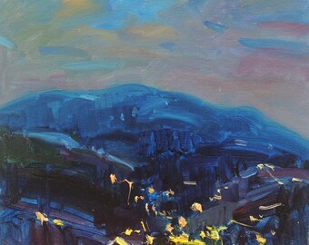 May include: An oil painting depicts a nighttime mountain landscape. The scene is dominated by a large, dark blue mountain range under a twilight sky. A crescent moon hangs in the upper left, and the lights of a town glow below.