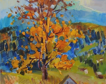 May include: An oil painting of a landscape featuring a tree with vibrant orange and yellow leaves. The tree stands in a field of yellow and green grass, with a small gray building in the foreground. Blue mountains and sky are in the background.