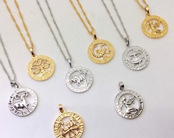 May include: A set of 10 gold and silver zodiac necklaces with pendants featuring different zodiac signs. The pendants are round and have a detailed design of the zodiac symbol.