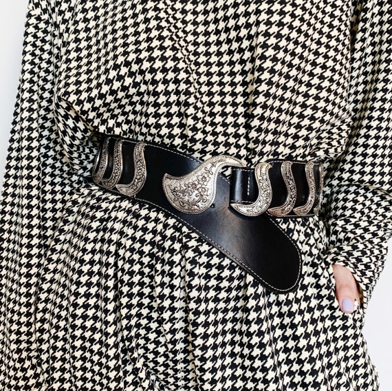 wide leather black belt with giant ornate silver b