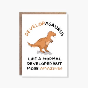 May include: A white card with a brown envelope. The card features a cartoon dinosaur with the text "Developasaurus" above it and "Like a normal developer but more amazing!" below it.
