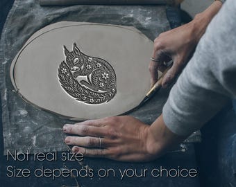 May include: A gray clay disc with a detailed, sleeping squirrel design. The squirrel is surrounded by floral patterns. The text "Not real size" and "Size depends on your choice" is at the bottom of the image.